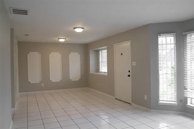 a view of an empty room and window