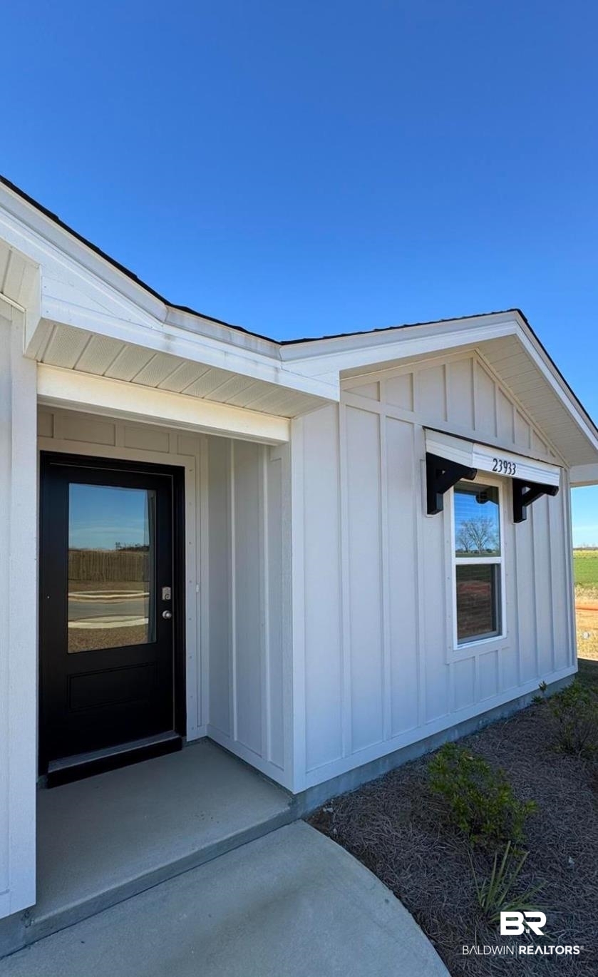 23933 Signor Place Daphne, AL 36526 - Photo 23 of 24 Property entrance featuring board and batten siding