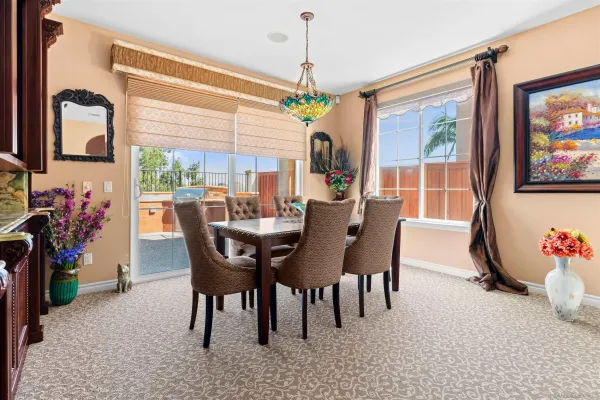 a large kitchen with granite countertop lots of counter space and windows