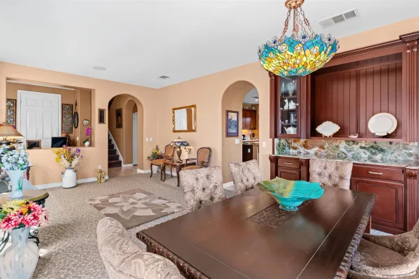 a living room with furniture large window and a fireplace