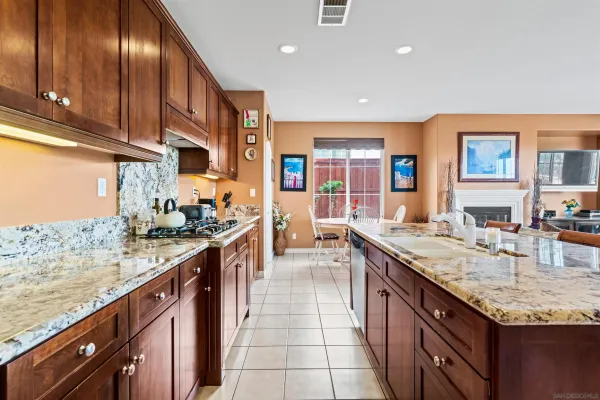 a bathroom with a toilet a sink and wall painting