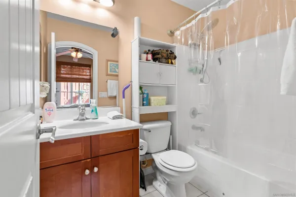 a spacious bedroom with a bed and a couch