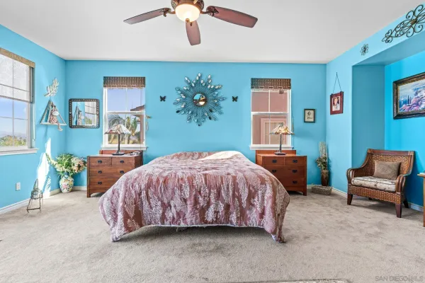 a bathroom with a sink a vanity a toilet a mirror and a shower