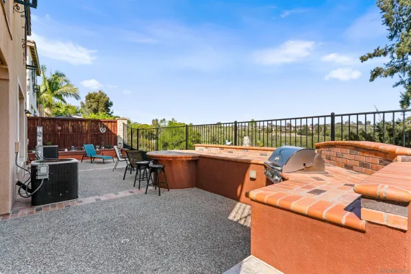 a view of a chairs and tables in the balcony
