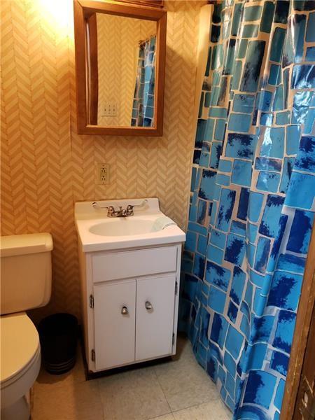1120 East Swissvale Avenue, Unit 3 FRONT Pittsburgh, PA 15221 - Photo 9 of 14 a bathroom with a sink and a toilet