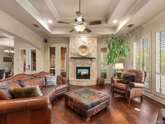 a living room with furniture and a fireplace