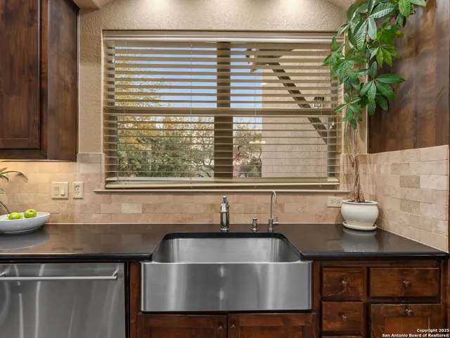 a stove top oven sitting inside of a kitchen