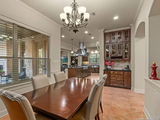 a view of a workspace with furniture and a bookshelf