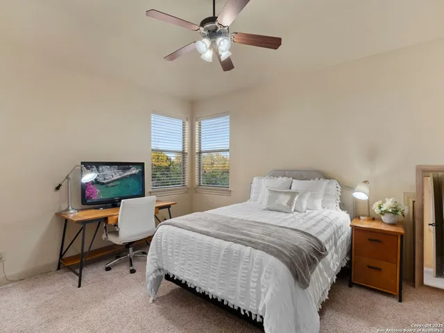 a bedroom with a bed and a chair