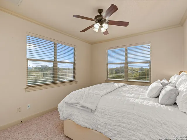 a bedroom with a bed furniture and a window