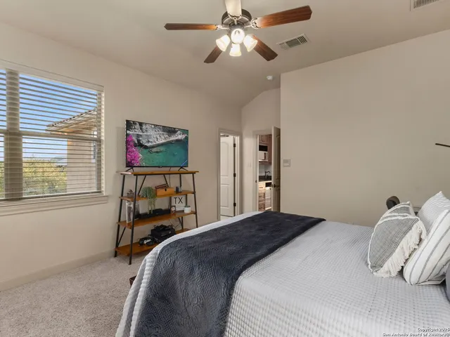 a living room with furniture pool table and a window