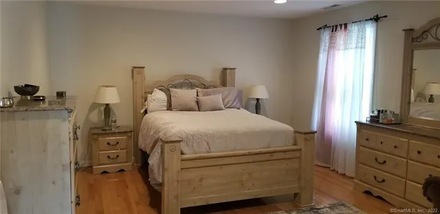 a bed room with a bed and a tv