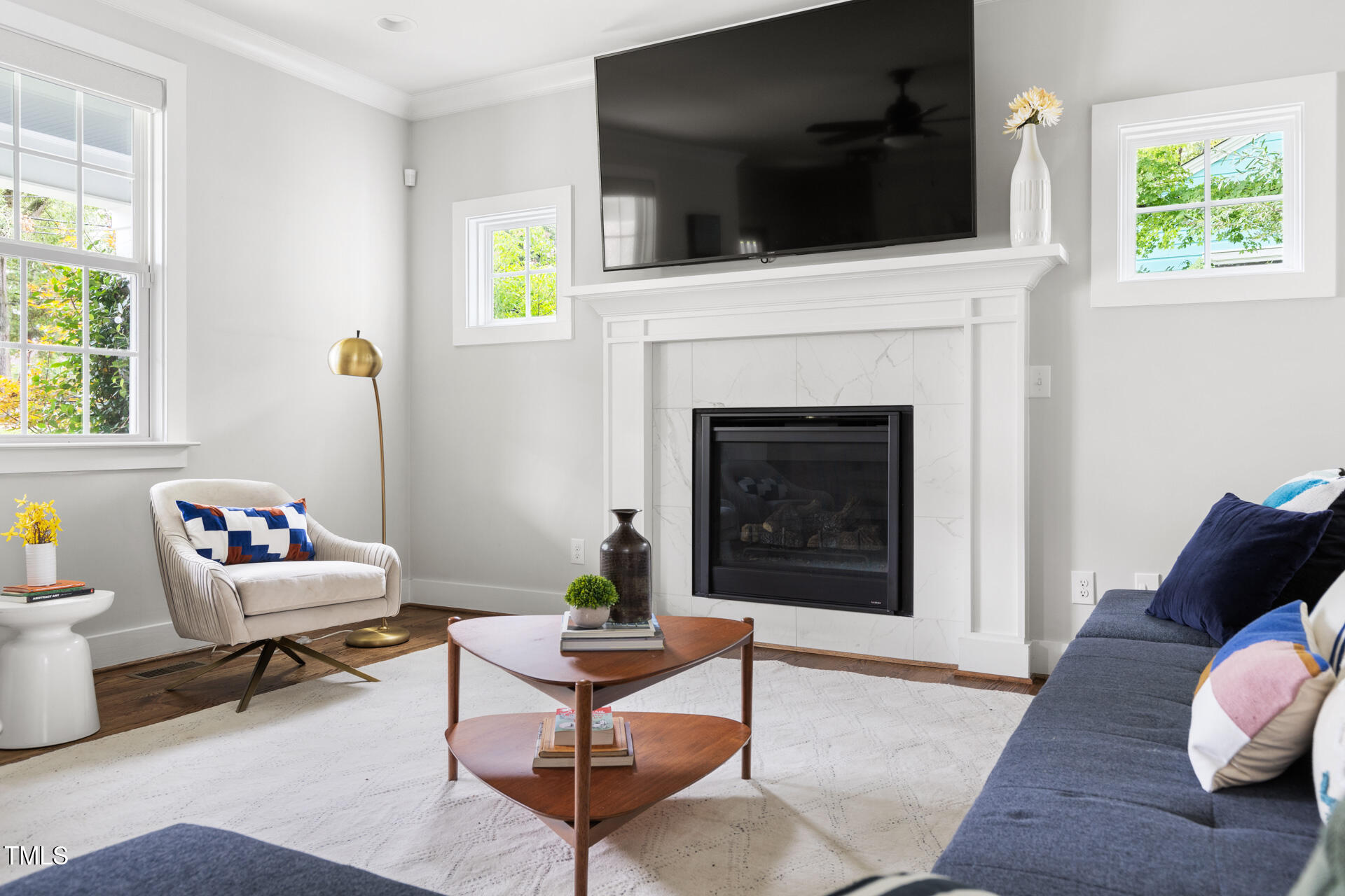 2929 Chapel Hill Road Durham, NC 27707 - Photo 11 of 38 a living room with furniture and a fireplace