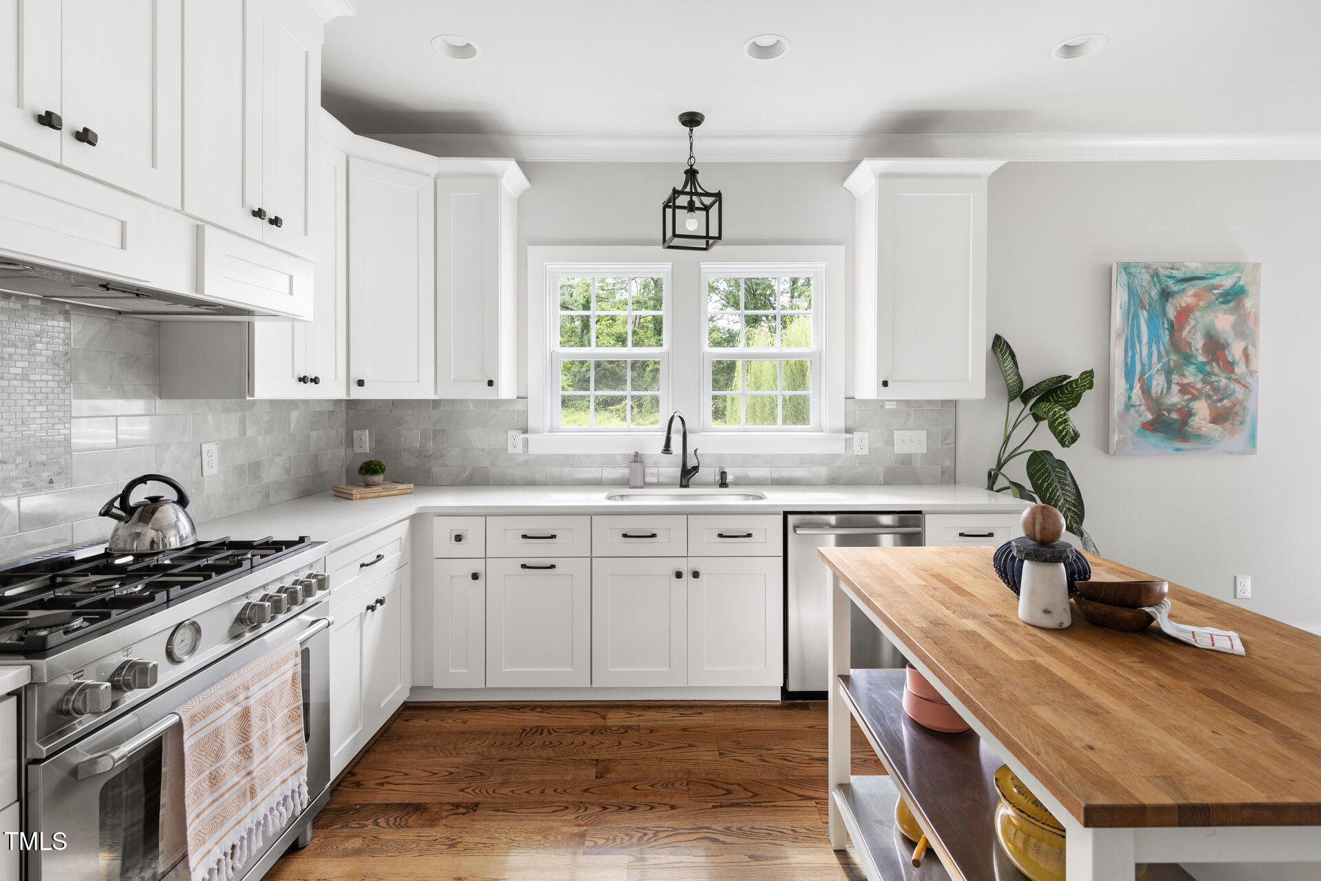 2929 Chapel Hill Road Durham, NC 27707 - Photo 17 of 38 a kitchen with a sink stove and window