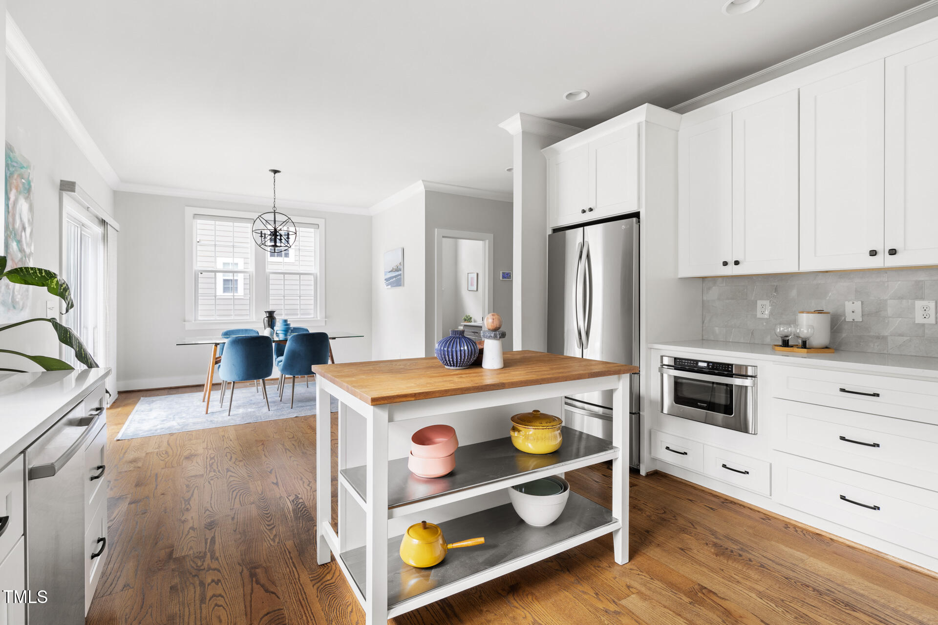 2929 Chapel Hill Road Durham, NC 27707 - Photo 19 of 38 a kitchen with stainless steel appliances a stove a sink and a refrigerator