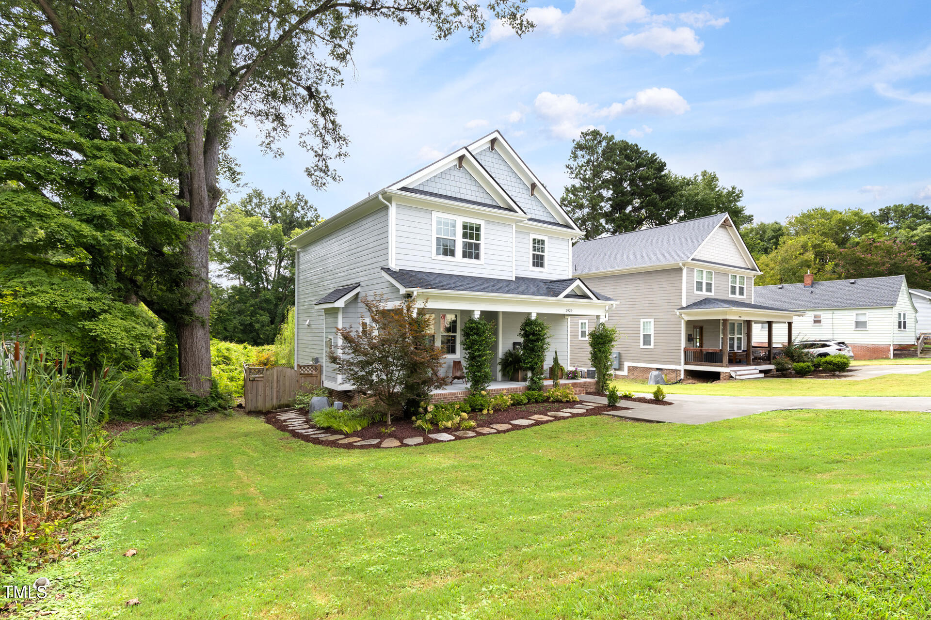 2929 Chapel Hill Road Durham, NC 27707 - Photo 2 of 38 a front view of a house with a yard table and chairs