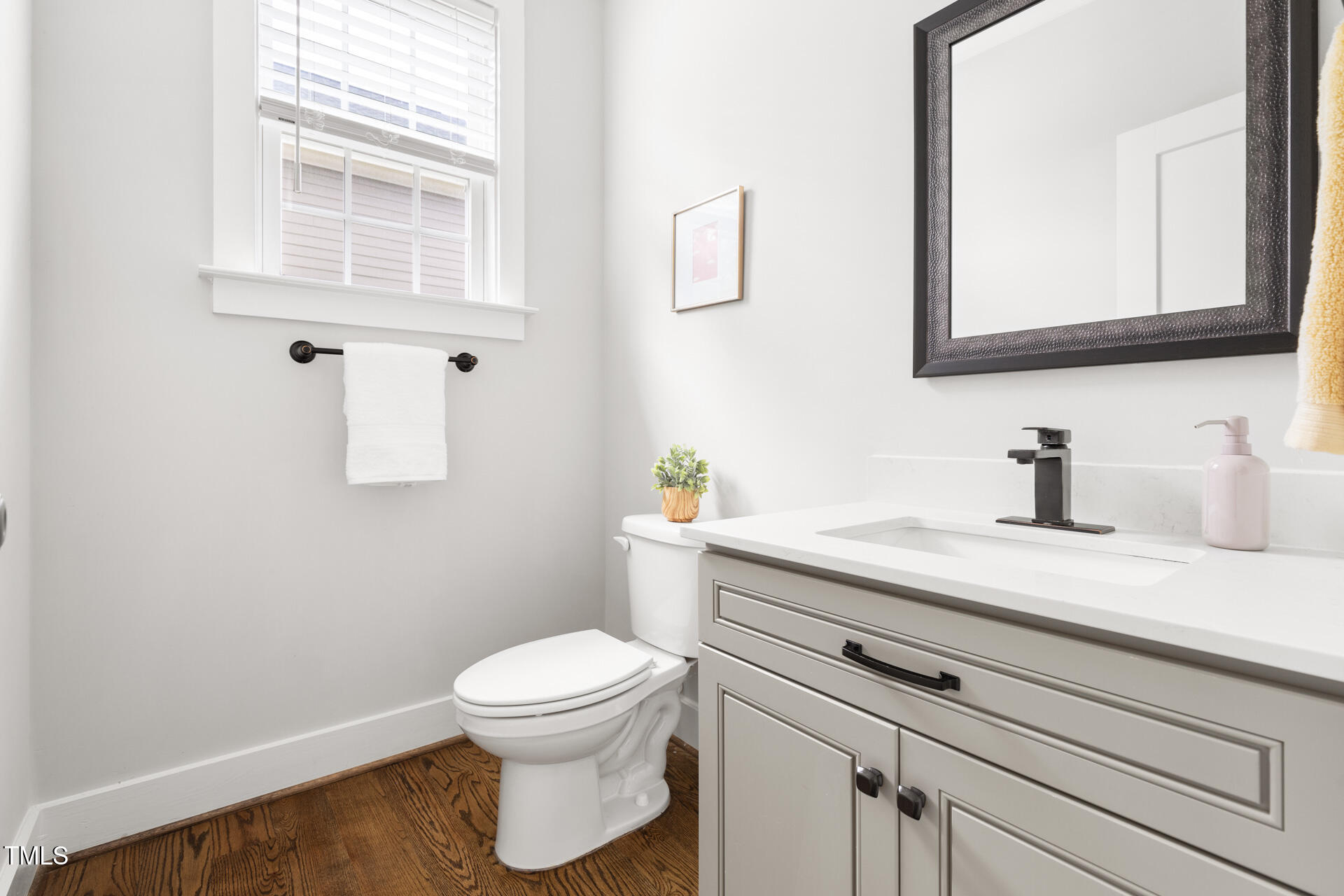 2929 Chapel Hill Road Durham, NC 27707 - Photo 22 of 38 a bathroom with a granite countertop toilet sink and mirror
