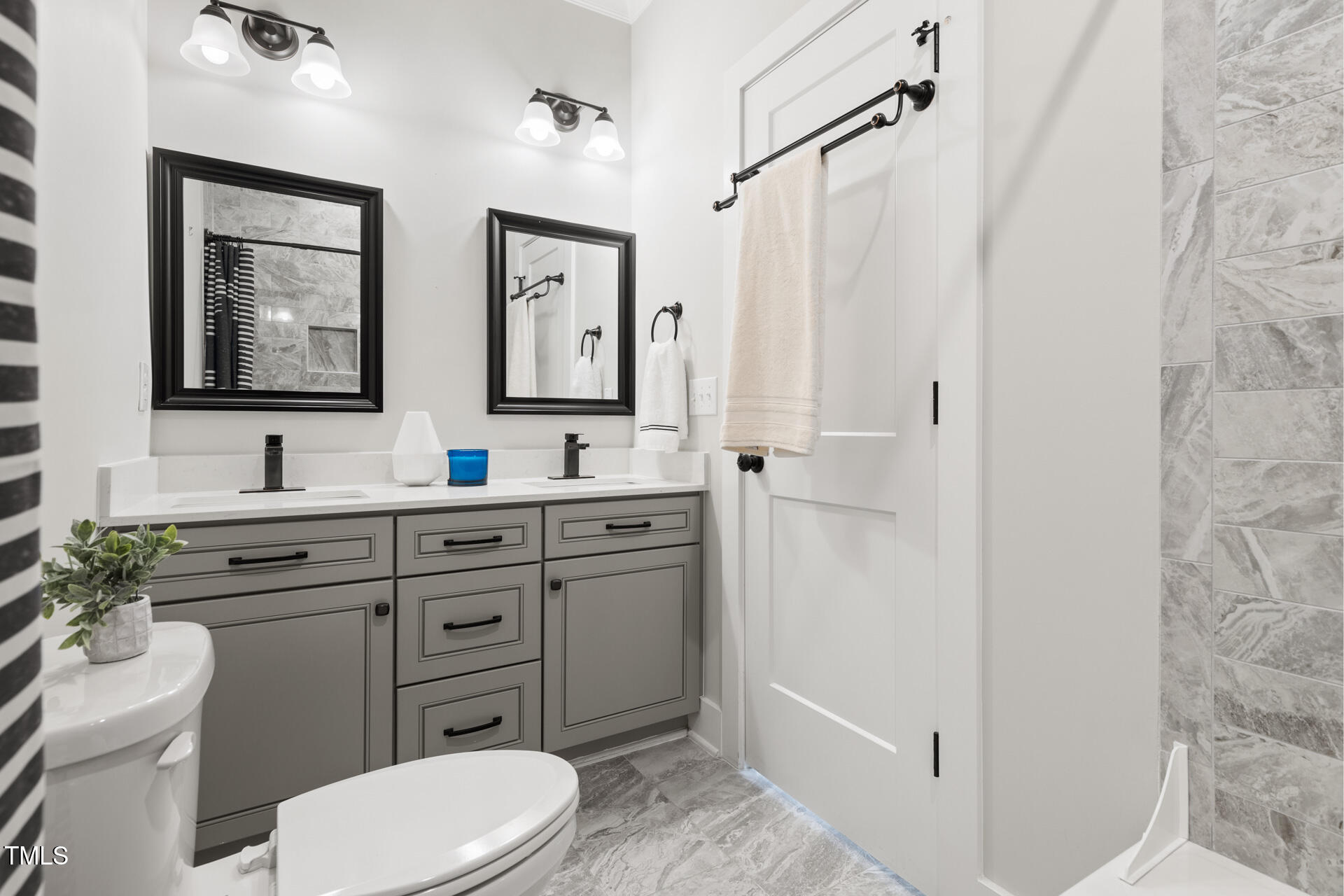 2929 Chapel Hill Road Durham, NC 27707 - Photo 32 of 38 a bathroom with a toilet sink and mirror