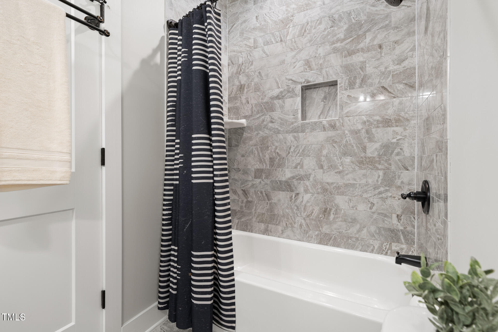 2929 Chapel Hill Road Durham, NC 27707 - Photo 33 of 38 a bathroom with a black white and white curtain