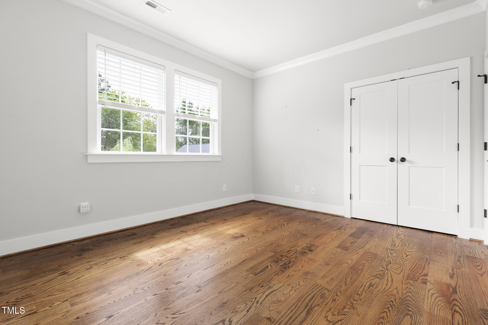 2929 Chapel Hill Road Durham, NC 27707 - Photo 34 of 38 a view of an empty room with wooden floor and a window
