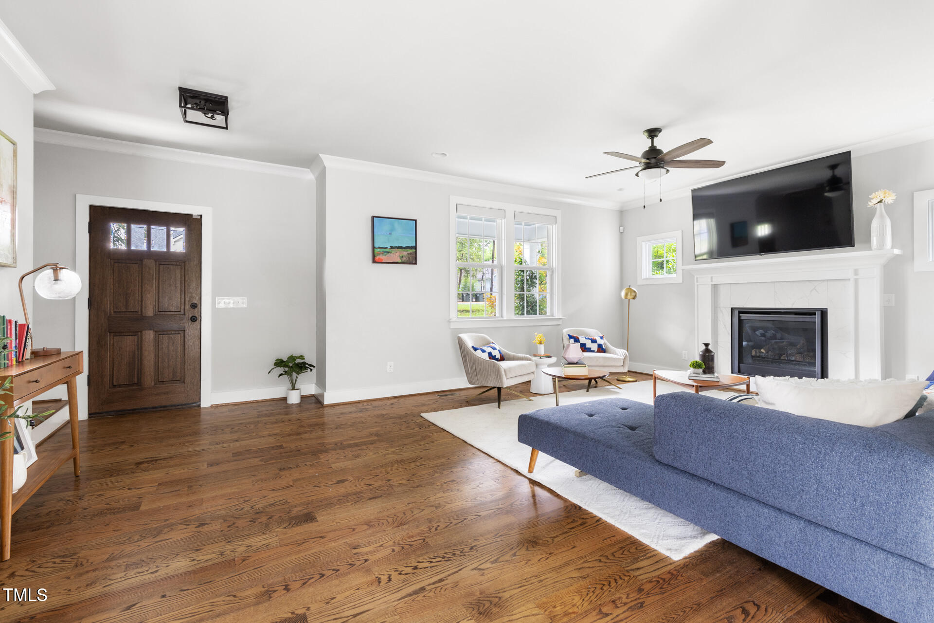 2929 Chapel Hill Road Durham, NC 27707 - Photo 7 of 38 a living room with furniture and a fireplace