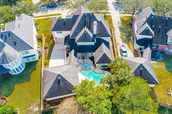 aerial view of a house with swimming pool and porch