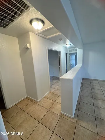 a view of storage and utility room with washer and dryer
