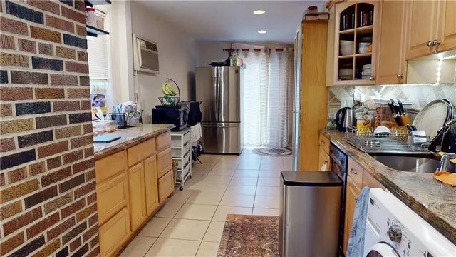 a kitchen with a sink and a refrigerator