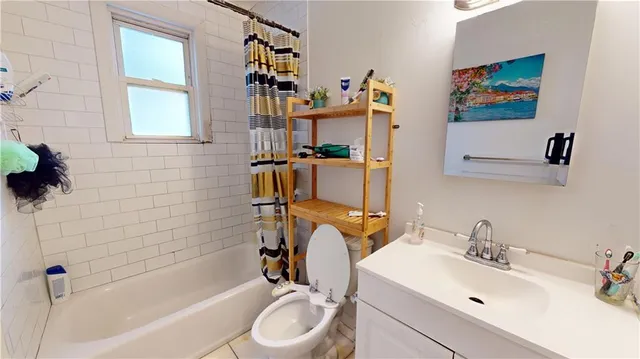 a bathroom with a sink a toilet and a bathtub