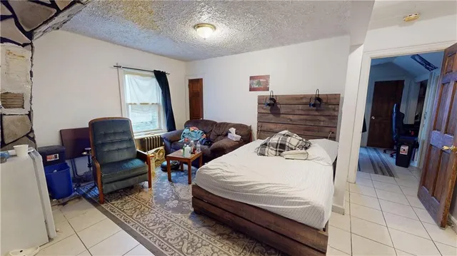 a bedroom with a bed and dresser