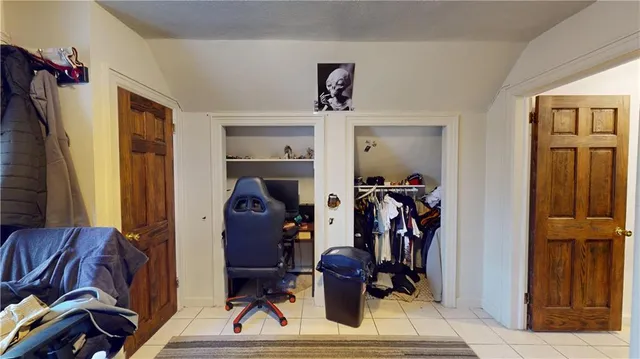 a view of living room with furniture and wooden floor