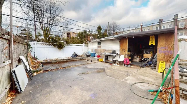 a view of a patio with table and chairs