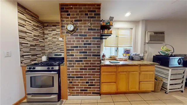 a kitchen with a stove and a sink