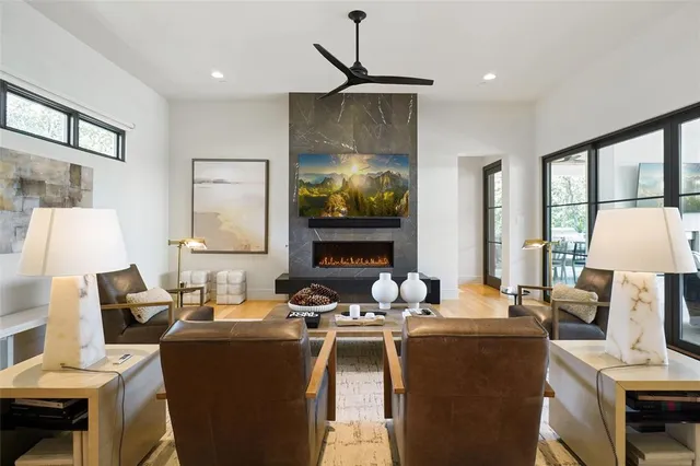 a living room with furniture a window and a fireplace
