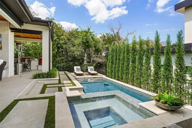 a view of a balcony with two chairs and a table