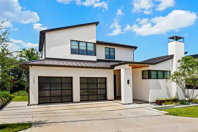 a front view of a house with a garage
