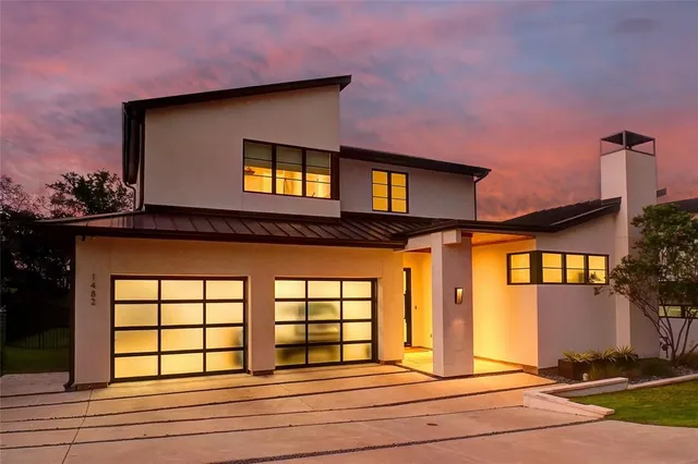 a front view of a house with a garage