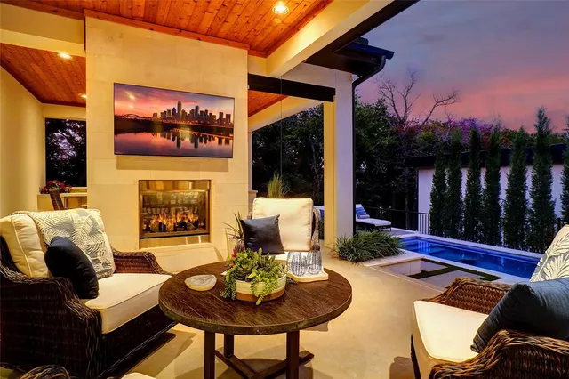 a outdoor space with patio fireplace and a potted plant