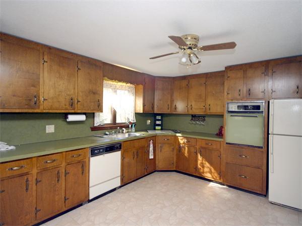 4 North Shore Road Holbrook, MA 02343 - Photo 8 of 24 a kitchen with stainless steel appliances granite countertop a sink and cabinets