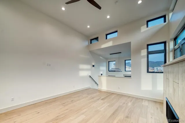 a view of a kitchen with a sink and a refrigerator