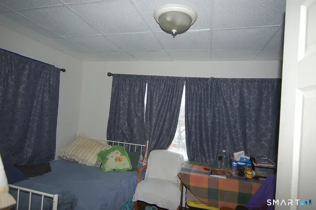a living room with a couch and a chandelier