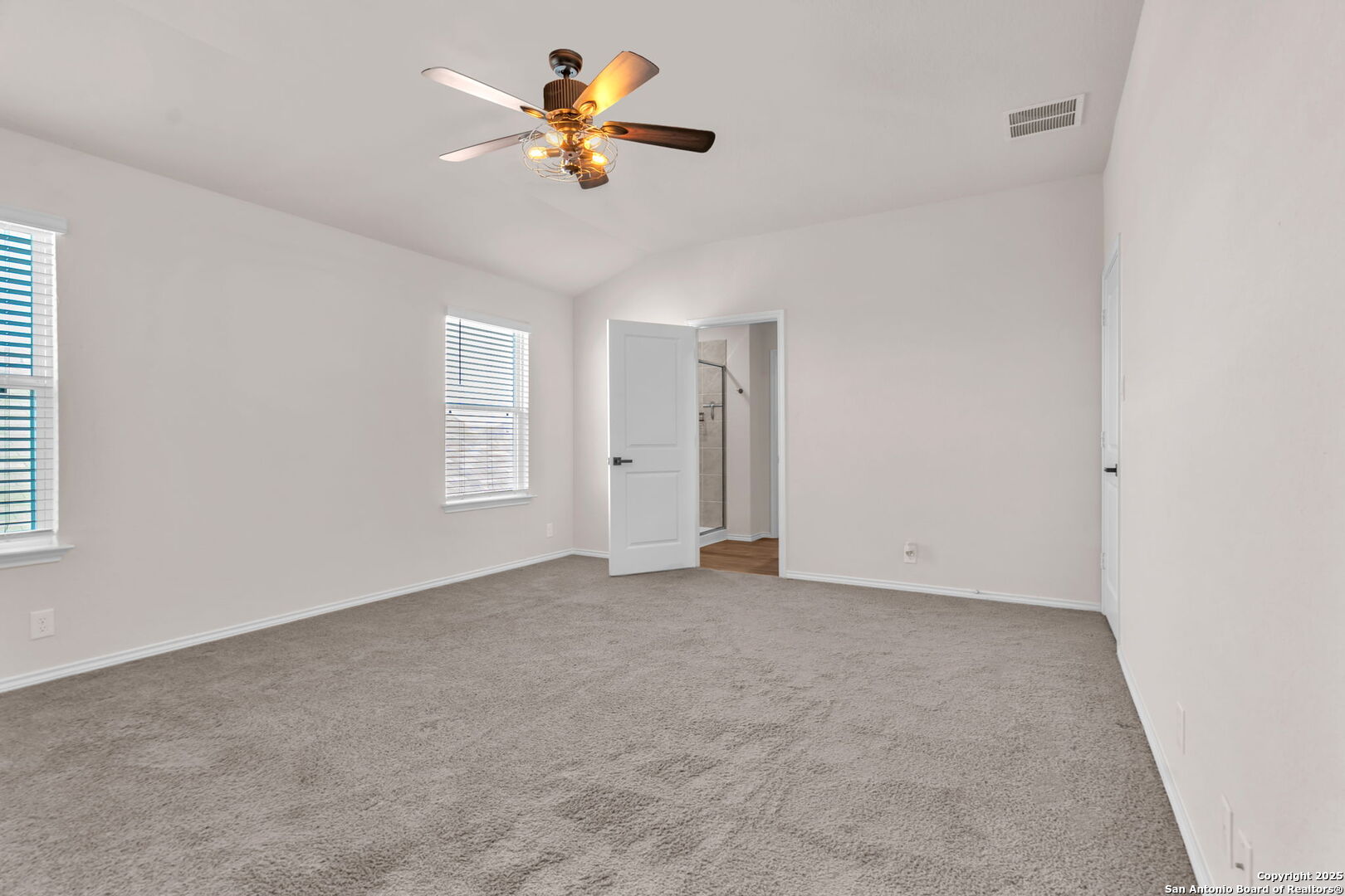 105 Honors Street Floresville, TX 78114 - Photo 17 of 36 an empty room with a window and a ceiling fan