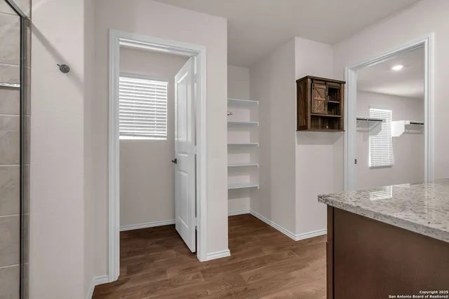 a view of a kitchen from the hallway