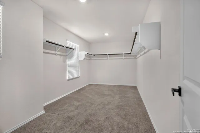 a view of a room with racks on the wall