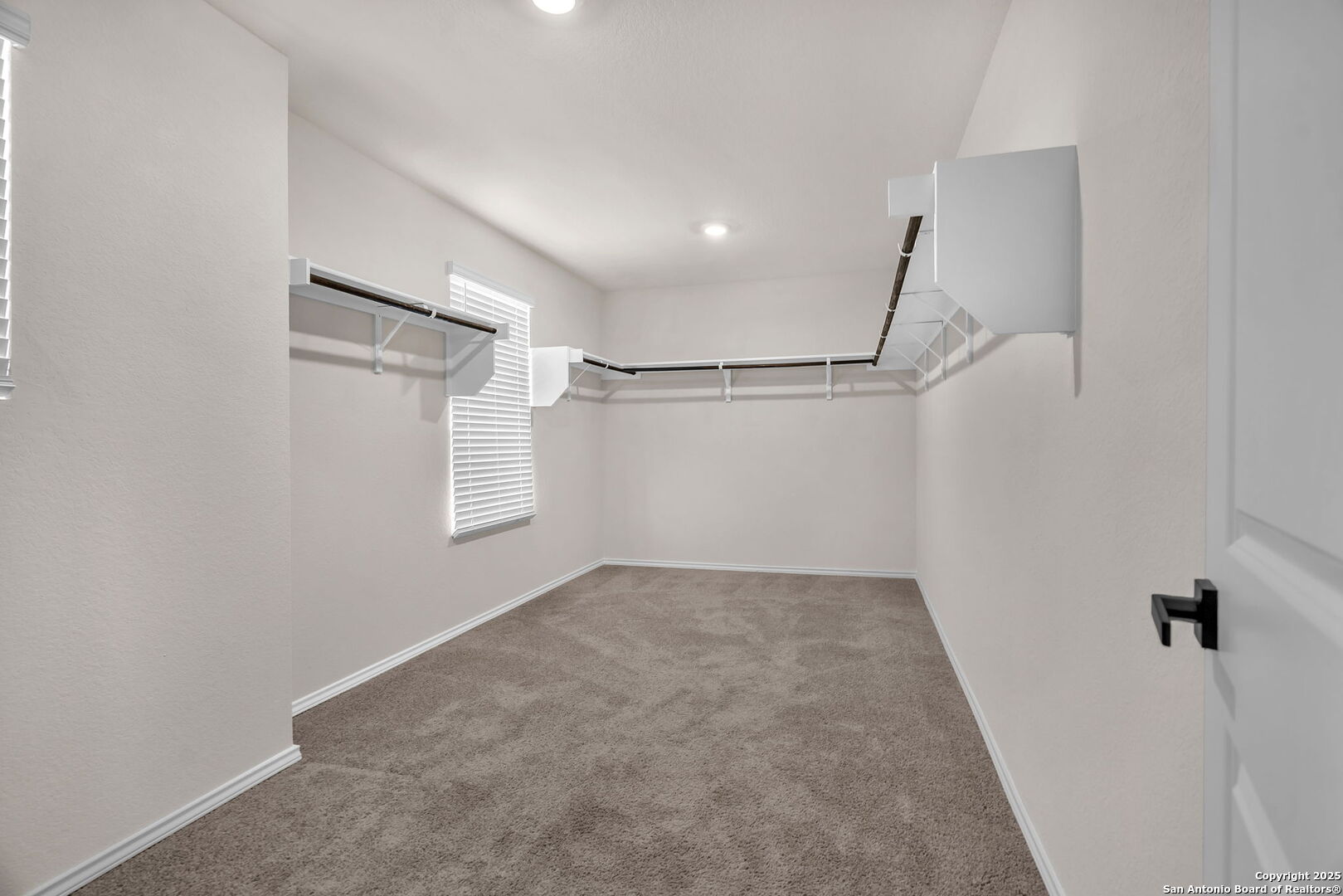 105 Honors Street Floresville, TX 78114 - Photo 23 of 36 a view of a room with racks on the wall