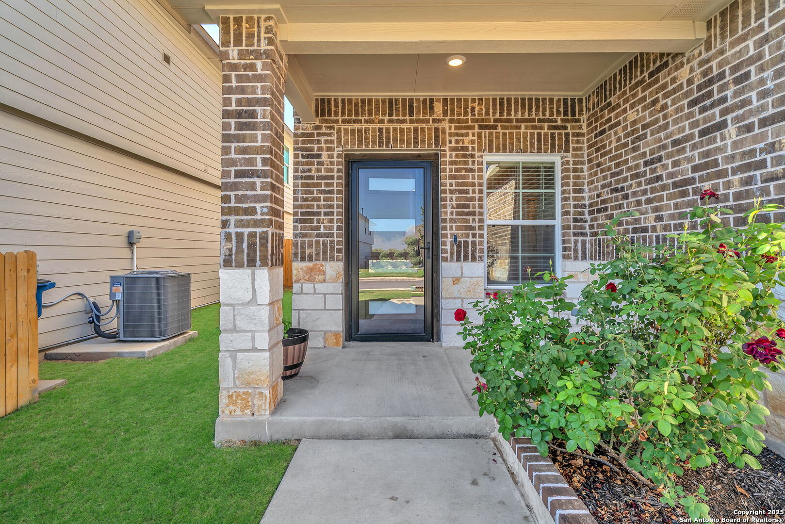 105 Honors Street Floresville, TX 78114 - Photo 3 of 36 a view of a house with a yard and sitting area