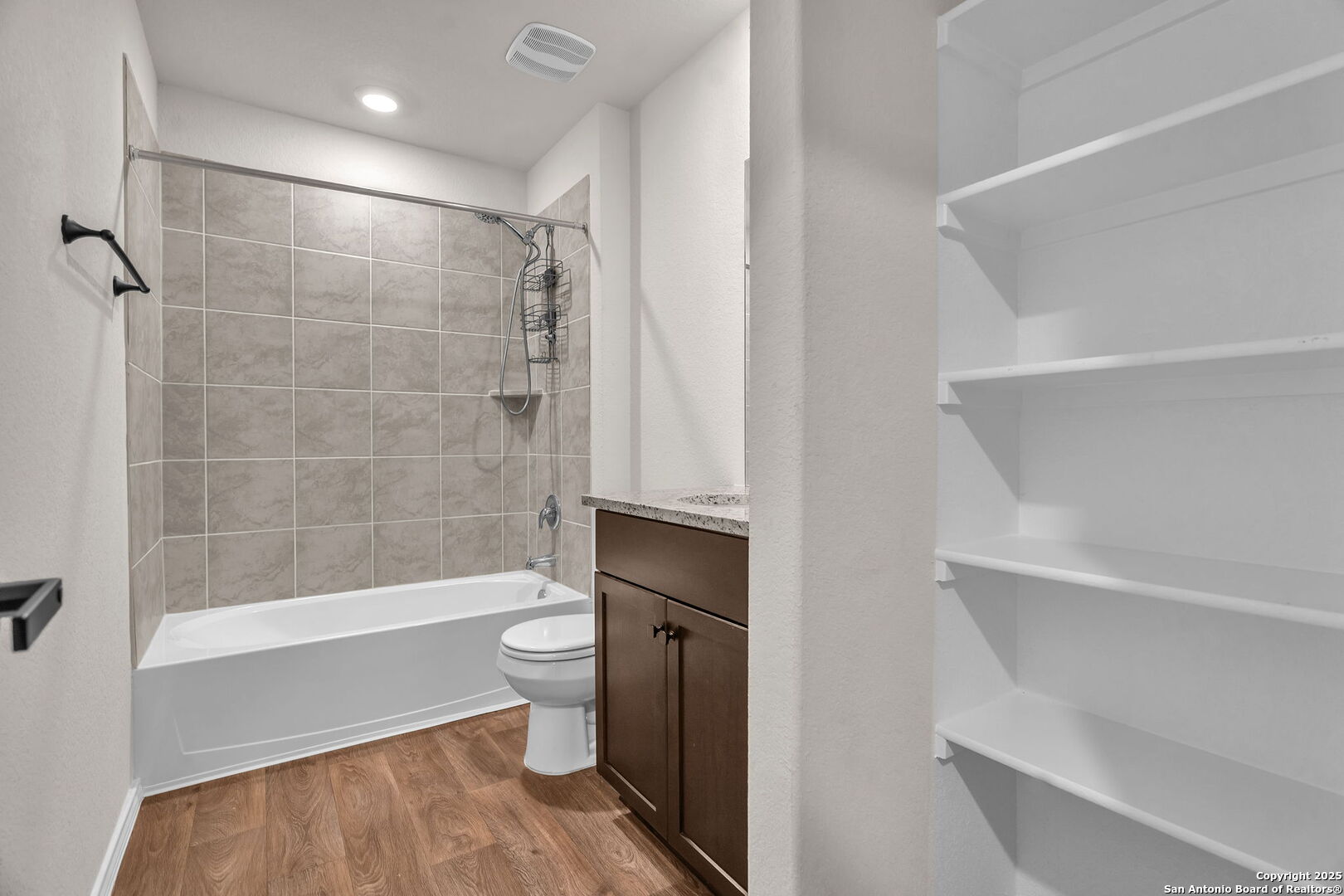 105 Honors Street Floresville, TX 78114 - Photo 31 of 36 a bathroom with a shower and a toilet