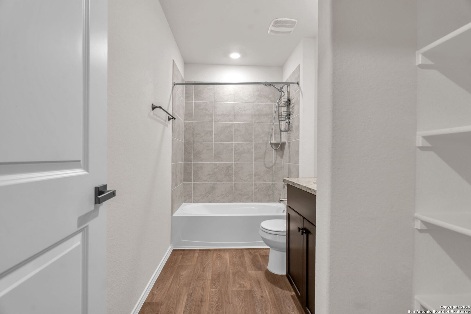 105 Honors Street Floresville, TX 78114 - Photo 32 of 36 a bathroom with a bathtub and a shower