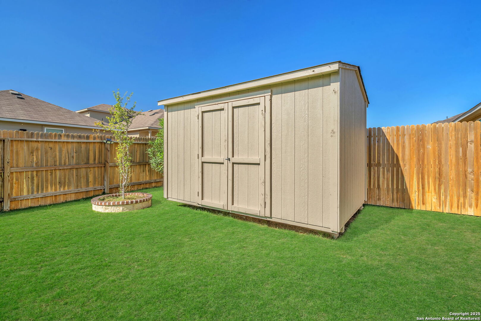 105 Honors Street Floresville, TX 78114 - Photo 33 of 36 a backyard with garden