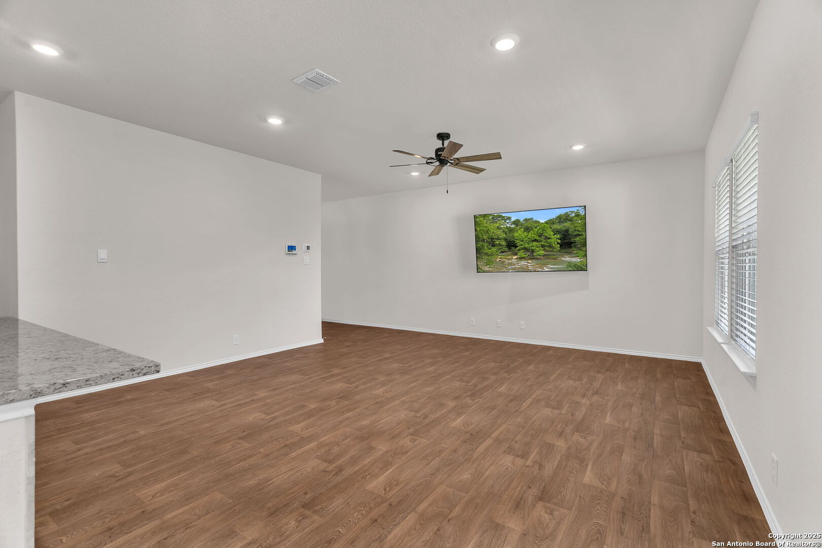 105 Honors Street Floresville, TX 78114 - Photo 7 of 36 a view of an empty room with a window